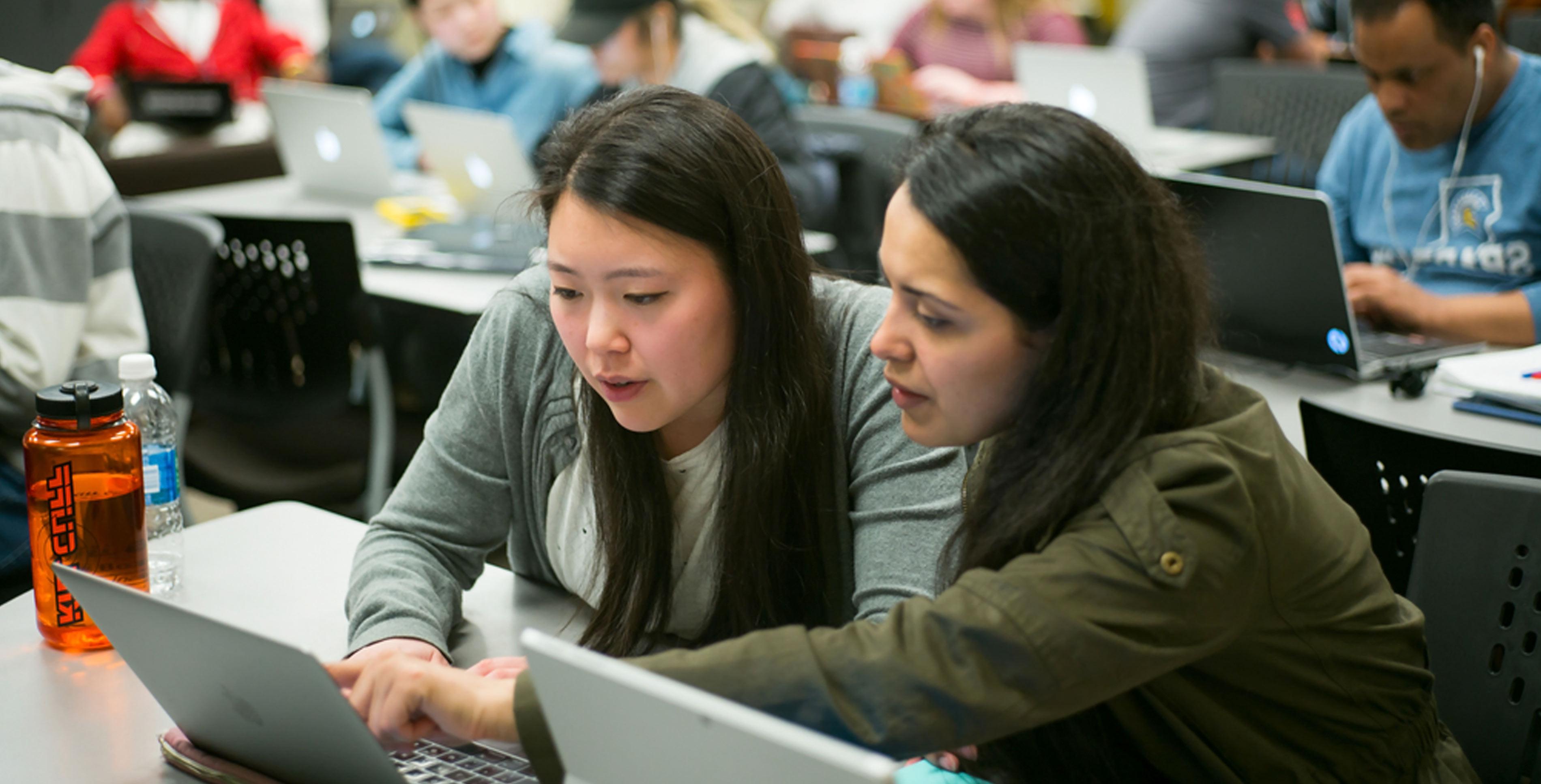 Two 菠菜网lol正规平台 students working on their computers.